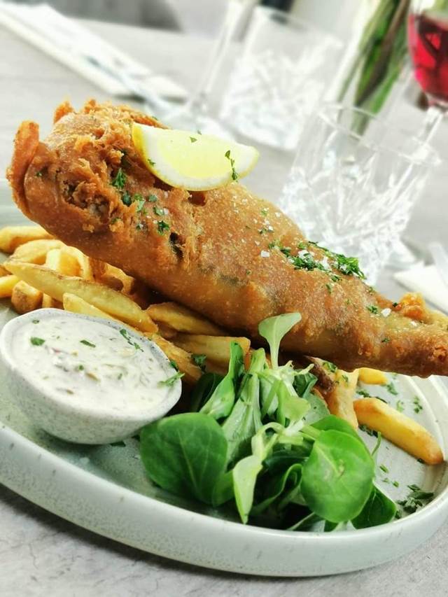 Fish and chips with homemade tartare sauce, fresh dressed salad and lemon
