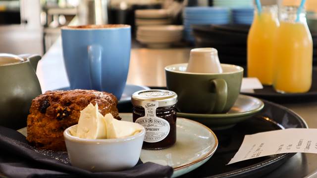 Cream tea, freshly baked scone with Tiptree jam and clotted cream with coffee