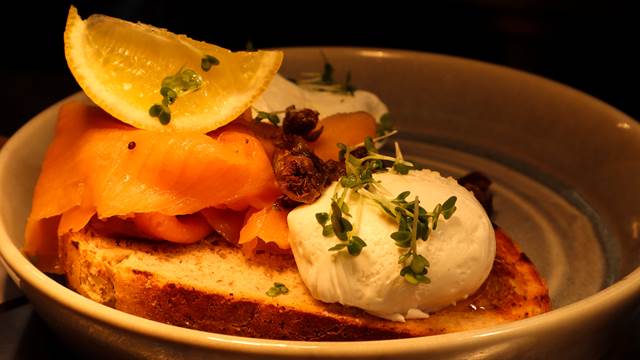 Toasted sourdough with smoked salmon, crispy capers, poached eggs, lemon and cress 